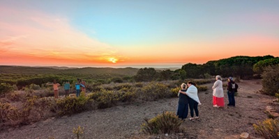 Guests enjoy a sunset on a yoga retreat for highly sensitive people