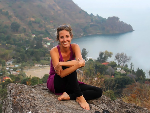 Yoga teacher Melissa Renzi sits atop mountain at Lake Atitlan